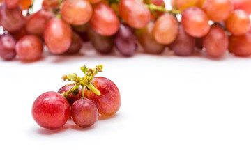 Ripe red grapes isolated on a white background, Grapes berries in the foreground