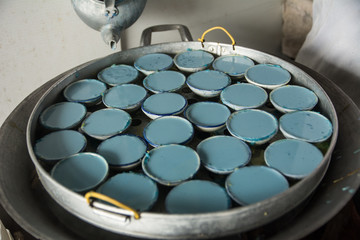 Ancient Thai Dessert (Bunga-Danmek) available in Thai market,Thai sweets,Blue and yellow dessert.