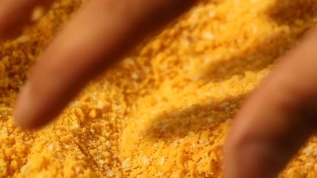 Fingers Picking Up Bread Crumbs