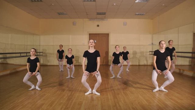 Little ballerinas dancing in dance studio