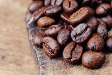 Coffee Bean on wood background with filter effect retro vintage