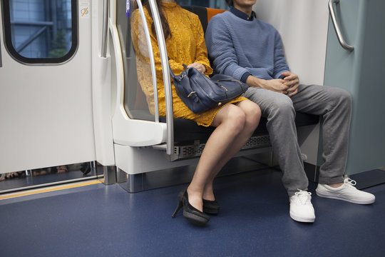 Young couple sitting in the train