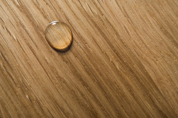 oil drop an a wooden surface