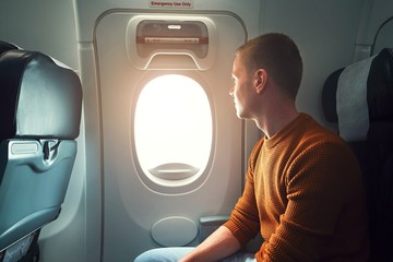 Naklejka premium Traveling by airplane
