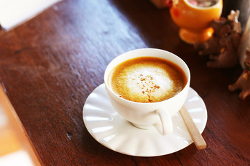 hot coffee latte serve on wooden bar