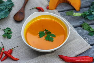 Pumpkin soup in white plate