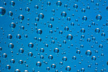 drop of water on blue background