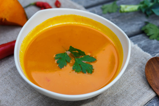 Pumpkin soup in white plate