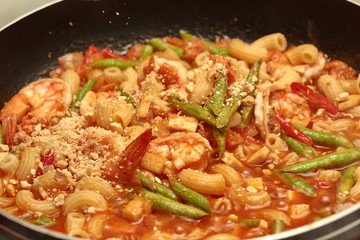 Home made ,Cooking Thai fried macaroni with shrimp , call Pad Thai Macaroni in Thai, in pan before served .