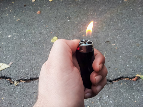 Hand holding lighter