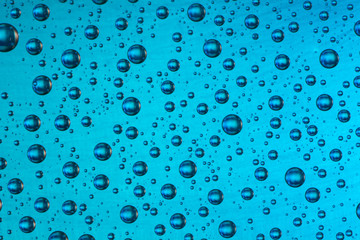 drop of water on blue background