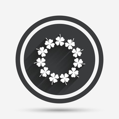 Wreath of clovers with four leaves sign.