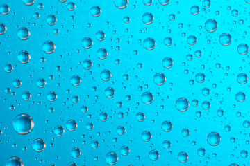 drop of water on blue background
