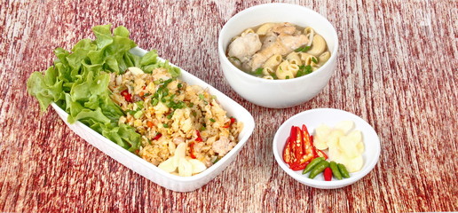 Home made,Fried garlic jasmine rice with minced pork served with side dish as Macaroni chicken soup and spicy filling