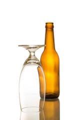 Shot of bottle and glass. on white isolated