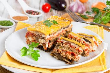 portion of delicious layered moussaka cut into slices