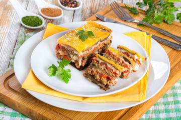 portion of delicious moussaka decorated with parsley