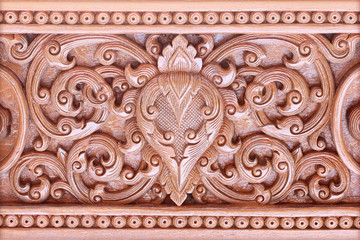 Pattern of flower carved on wood background