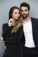 Stunning man and woman in smart clothes