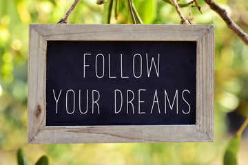 chalkboard with the text follow your dreams
