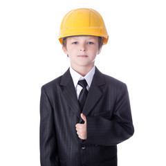 portrait of little boy in business suit and builder's helmet iso