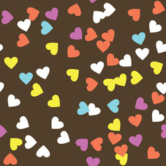 Donut glaze seamless pattern. Cream texture with sprinkle topping of colorful hearts on chocolate background. Food bakery decoration. Vector eps8 illustration.