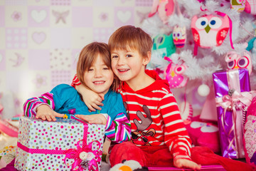 Happy brother embraces his cheerful sister