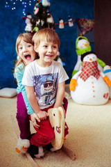 Adorable little kids on the wooden toy