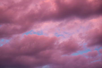 Colourful skyscape with purple clouds at sudown dusk
