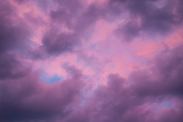 Colorful skyscape with purple clouds at sundown twilight