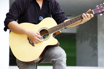 Man is playing guitar