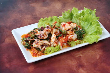 Fried spicy mixed herb  with squid and spicy sour filling.