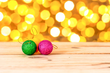the christmas ball on wooden in bokeh light background