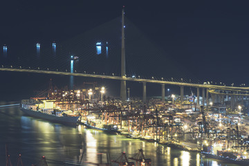 Fototapeta na wymiar Cargo Port, bridge and Highway in Hong Kong