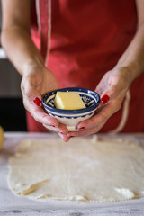 unrecognizable woman cooking apple pie
