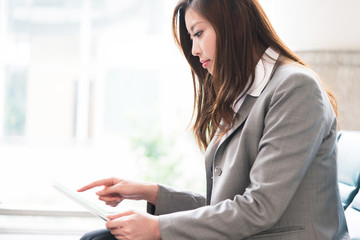 beautiful asian young girl with tablet
