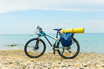 Fototapeta premium Parked at the beach mountain bike ready to travel.