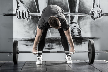 Obraz na płótnie Canvas Workout with barbell in gym