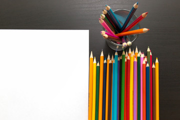 Fototapeta premium Colored pencils and sheet of paper