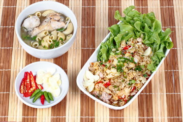 Home made,Fried garlic jasmine rice with minced pork served with side dish as Macaroni chicken soup and spicy filling