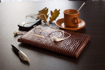 Diary, mobile phone and coffee