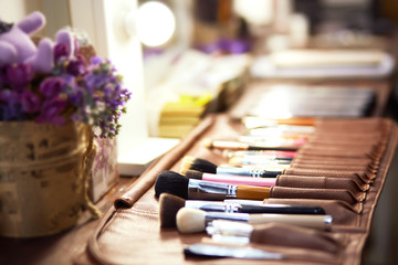 Cosmetics on dark background, closeup
