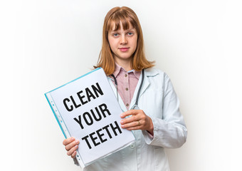 Doctor showing clipboard with written text: Clean Your Teeth
