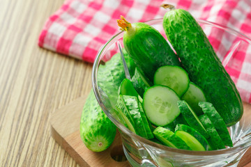  cucumbers on wooden background
