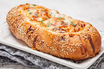 Baked fish casserole in a bread bowl