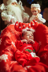 Funny child and a Santa Claus