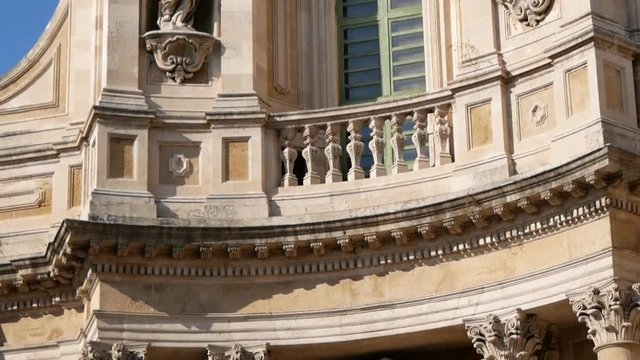 Detail of the facade of the Collegiate Basilica (also known as Saint Mary of the ALMS) is a church in Catania, Sicily, southern Italy. Finished in 1768, it is an example of Sicilian Baroque.