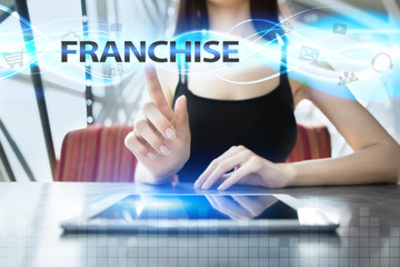 Woman is using tablet pc, pressing on virtual screen and selecting franchise