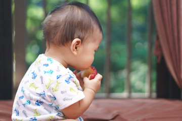 Asian baby and apple