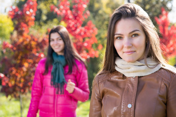 Two women in autumn park